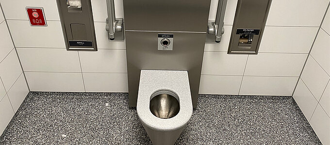 Interior of a restroom facility, toilet