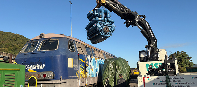 Engine replacement on locomotive with crane