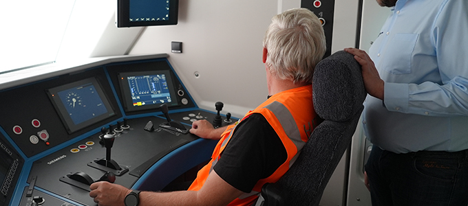 Train driver in the driver's cab