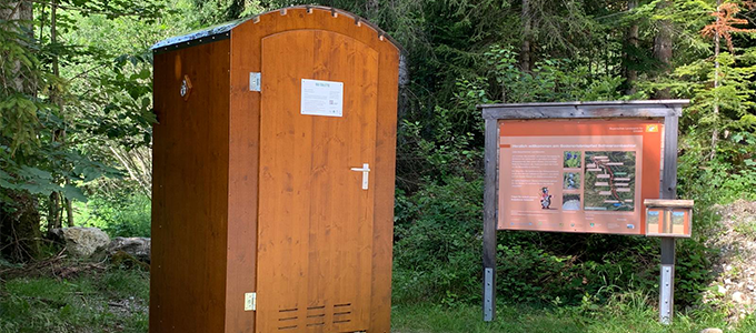 Self-contained public toilet facility along a hiking trail